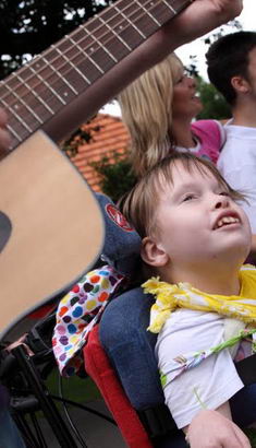 Children and adults enjoy a musical activity