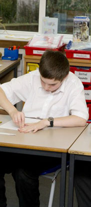 girl at desk with teacher