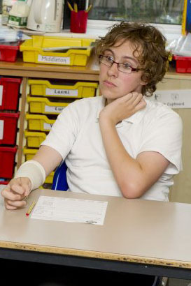 girl at desk with teacher