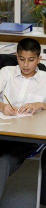 girl at desk with teacher