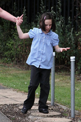 A teenage girl dances to music