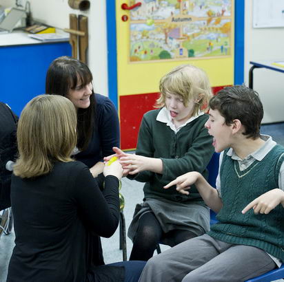 Positive behaviour in the classroom:
                  Two students and two teachers