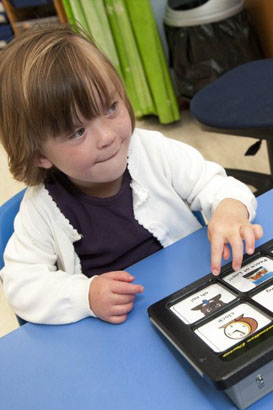 A girl looks at a card