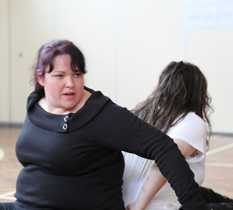 A girl participating in a Sherborne developmental
                  movement session