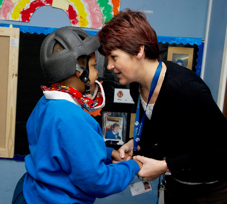 Teacher looking in to the eyes of
                  a boy