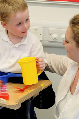 Boy talking to teacher