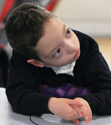 A boy in standing support