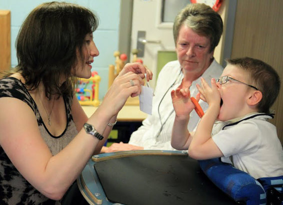 Boy with two carers