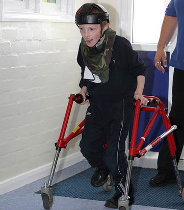 Boy with walking support