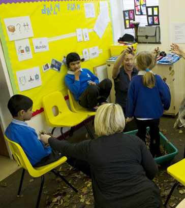 Adults and children participating in a
                  call and response group