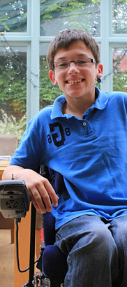 Boy in wheelchair smiling