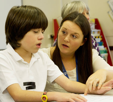 A boy and a teaching assistant