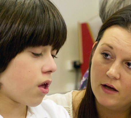 A boy and a teaching assistant