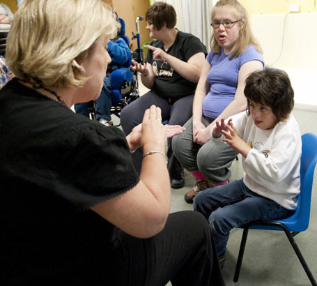 Teacher calming a boy