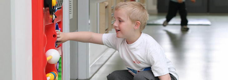 A young boy uses multi-sensory equipment