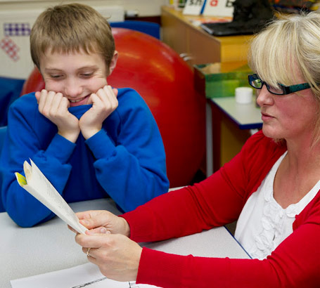 Teacher telling story to boy