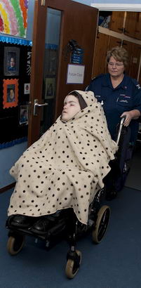 Wheelchair pupil arriving at school