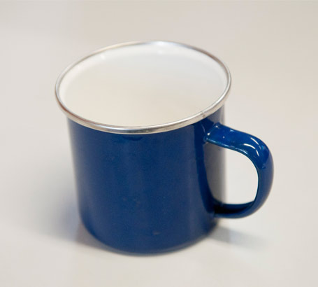 A blue mug photographed on its
                  own and used as an object of reference