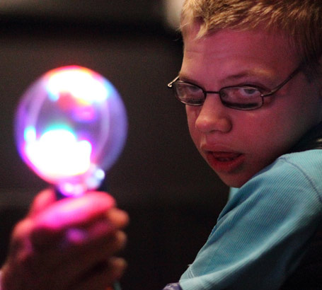 Boy with glasses takes part in visual
                  tracking exercise