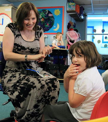 A girl looks at the camera during a signing
                  session