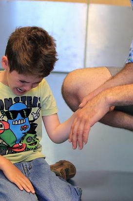 Distressed boy with carer