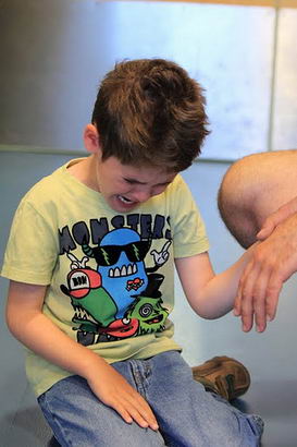 Distressed boy with carer