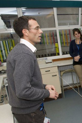 Teachers meet round desk]