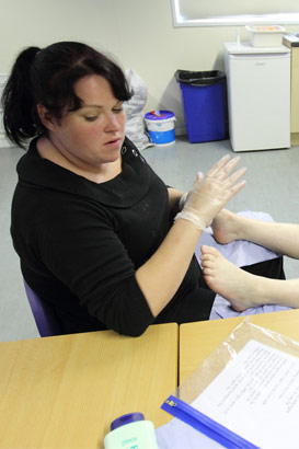 A girl receives physiotherapy on her feet