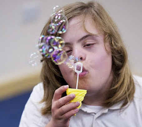 Girl blowing bubbles