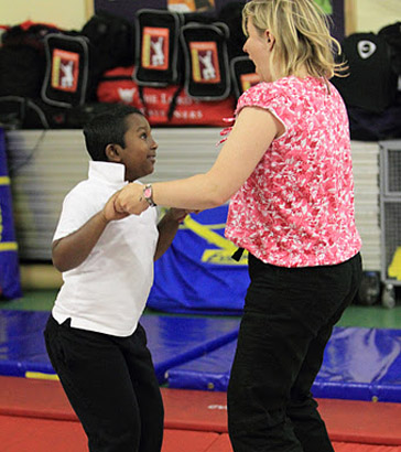 Teacher and a boy on the trampoline