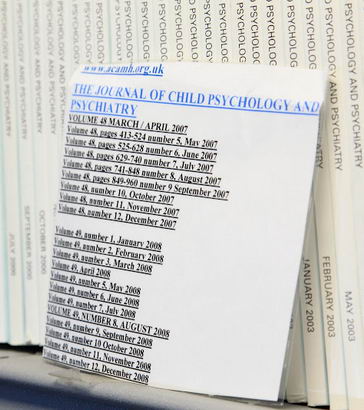A library shelf containing multiple copies
                  of the Journal of Child Psychology and Psychiatry