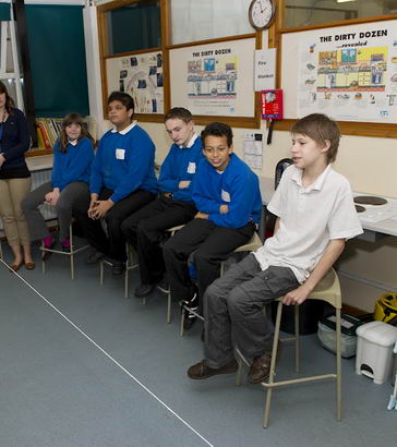 A male teacher disseminates findings
                  to his class