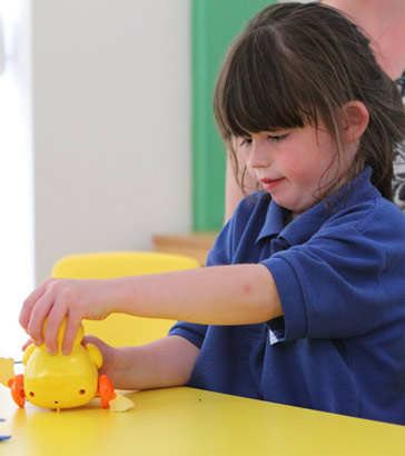 A girl with a toy duck
